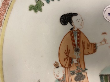 A large Chinese famille verte dish with ladies and boys in a garden, Kangxi